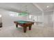 Spacious basement featuring a classic pool table with green felt and wood frame at 6116 W Frost Dr, Littleton, CO 80128