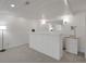 Finished basement features a stylish bar with a wine cooler and modern lighting at 6116 W Frost Dr, Littleton, CO 80128