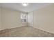 Carpeted bedroom showcasing a shuttered window and a single door closet at 6116 W Frost Dr, Littleton, CO 80128