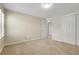 Cozy bedroom with neutral carpet and paint, plus a double-door closet for storage at 6116 W Frost Dr, Littleton, CO 80128
