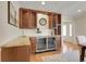 Stylish dining area featuring custom built-in cabinetry, wine storage, and elegant countertops for entertaining at 6116 W Frost Dr, Littleton, CO 80128