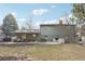 Large backyard with a grill, patio furniture, a covered patio, and a shed at 2616 S Leyden St, Denver, CO 80222