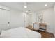 Bright bedroom features a dedicated workspace and a comfortable sleeping area at 2616 S Leyden St, Denver, CO 80222