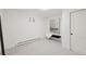 Bedroom with neutral walls and carpet, bench, and a picture on the wall at 2616 S Leyden St, Denver, CO 80222
