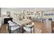 Open dining area with hardwood floors and view of kitchen and staircase at 2616 S Leyden St, Denver, CO 80222