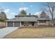 Charming two-story home with a three-car garage and inviting stone accents at 2616 S Leyden St, Denver, CO 80222