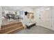 Welcoming home foyer with tile floors and coat rack that leads to a dining room at 2616 S Leyden St, Denver, CO 80222