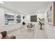 A well-lit home office featuring a clear desk, plush chair, modern decor, and bright natural light at 2616 S Leyden St, Denver, CO 80222