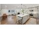 A spacious, modern kitchen featuring a large island with bar seating and stainless steel appliances at 2616 S Leyden St, Denver, CO 80222