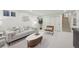 Open living room features modern furniture, recessed lights, and a large window at 2616 S Leyden St, Denver, CO 80222
