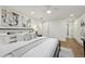 Spacious main bedroom with a comfortable bed, stylish decor, and hardwood flooring at 2616 S Leyden St, Denver, CO 80222