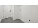A mud room with gray tile floor, white walls and trim, and a modern door at 2616 S Leyden St, Denver, CO 80222