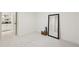 Unfurnished room with a large mirror, neutral walls, and carpet at 2616 S Leyden St, Denver, CO 80222