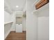 Bright walk-in closet with custom shelving and hardwood flooring at 2616 S Leyden St, Denver, CO 80222