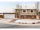Charming two-story home with brick accents, attached garage, and a well-maintained front yard at 9240 W Wagon Trail Dr, Littleton, CO 80123