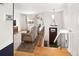 Inviting living room features hardwood floors, neutral decor, and a staircase leading to the upper level at 9240 W Wagon Trail Dr, Littleton, CO 80123