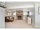 Inviting living room with stone fireplace, soft carpet, and stylish furniture at 9240 W Wagon Trail Dr, Littleton, CO 80123