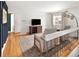 Bright living room with hardwood floors, comfortable seating, and plenty of natural light at 9240 W Wagon Trail Dr, Littleton, CO 80123