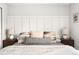 Comfortable main bedroom with decorative pillows and lamps on the bedside tables at 9240 W Wagon Trail Dr, Littleton, CO 80123