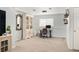 Comfortable home office with a stylish desk, chair, and built-in shelving for storage at 9240 W Wagon Trail Dr, Littleton, CO 80123