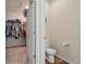 En suite bathroom with walk-in closet and modern fixtures at 2342 Shipman St, Brighton, CO 80603