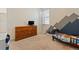 bedroom with mountain mural and large dresser at 2342 Shipman St, Brighton, CO 80603