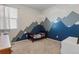 Bedroom with a mountain mural at 2342 Shipman St, Brighton, CO 80603