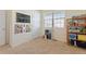 bedroom with a chalkboard wall and organized shelves at 2342 Shipman St, Brighton, CO 80603