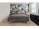 Bedroom featuring a geometric wall design and a bed at 2342 Shipman St, Brighton, CO 80603