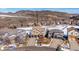 Property aerial view with expansive desert landscape and nearby mountain views at 16403 River Haven Way, Morrison, CO 80465