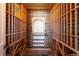 Spacious wine room with custom wood racking for ample bottle storage at 16403 River Haven Way, Morrison, CO 80465