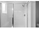 Modern bathroom featuring a glass enclosed shower, white subway tile, bench and showerhead at 2740 W 68Th Ave, Denver, CO 80221