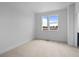 Bedroom with neutral carpet and windows with a view at 2740 W 68Th Ave, Denver, CO 80221