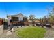 Inviting backyard featuring a manicured lawn, stone landscaping, outdoor seating and deck access at 949 Raleigh St # 2, Denver, CO 80204