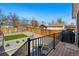 Spacious backyard features a deck, gravel area with grass, and privacy fencing, perfect for outdoor gatherings at 949 Raleigh St # 2, Denver, CO 80204