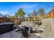 Beautiful backyard with a hot tub, fire pit area, and landscaped tiers, ideal for relaxing and entertaining at 949 Raleigh St # 2, Denver, CO 80204