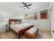 Comfortable bedroom with wooden bed frame, stylish decor, and natural light from window, creating a cozy space at 949 Raleigh St # 2, Denver, CO 80204