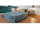 Cozy bedroom with a large comfortable bed, wooden floors, and neutral decor, with great natural light at 949 Raleigh St # 2, Denver, CO 80204