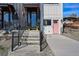 Charming townhouse entrance with a black door, pink door, and landscaped front yard at 949 Raleigh St # 2, Denver, CO 80204