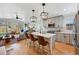 Open kitchen with quartz countertops, stainless steel appliances, and stylish pendant lighting at 949 Raleigh St # 2, Denver, CO 80204