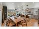 Open layout showing the kitchen, dining area, and living room with lots of natural light at 949 Raleigh St # 2, Denver, CO 80204