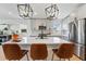 Bright kitchen with island seating, modern lighting, and stainless steel appliances at 949 Raleigh St # 2, Denver, CO 80204