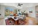 Comfortable living room with large sectional sofa, wood floors, and sliding glass doors to the backyard at 949 Raleigh St # 2, Denver, CO 80204