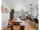 Bright, open-concept living space featuring dining area, modern kitchen, and large windows offering abundant natural light at 949 Raleigh St # 2, Denver, CO 80204