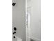 Modern shower with white tile, matte black fixtures, and sleek design, creating a spa-like experience at 949 Raleigh St # 2, Denver, CO 80204
