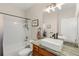 Bathroom showcasing a white subway tile shower, and a granite vanity with vessel sink at 8073 W 51St Pl # 303, Arvada, CO 80002