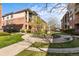 Exterior shot of a condo community featuring beautiful landscaping and walkways at 8073 W 51St Pl # 303, Arvada, CO 80002