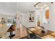 Open floor plan integrating dining and kitchen with modern furnishings and decor at 8073 W 51St Pl # 303, Arvada, CO 80002