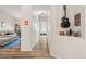 Hallway featuring an alcove with a guitar, leading to living areas and bedrooms at 8073 W 51St Pl # 303, Arvada, CO 80002