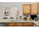 Granite countertop, stainless sink, and lots of counter space highlight this kitchen space at 8073 W 51St Pl # 303, Arvada, CO 80002